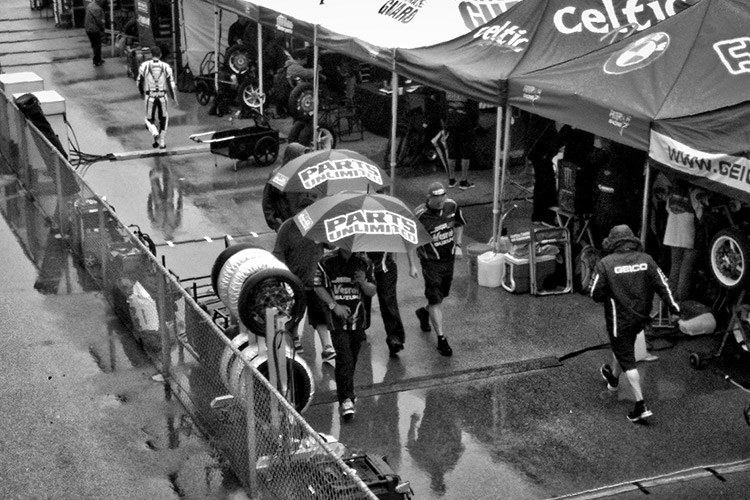 Rain falls in the tent-only pit area of the AMA Supersport  teams at Miller Motorsports Park